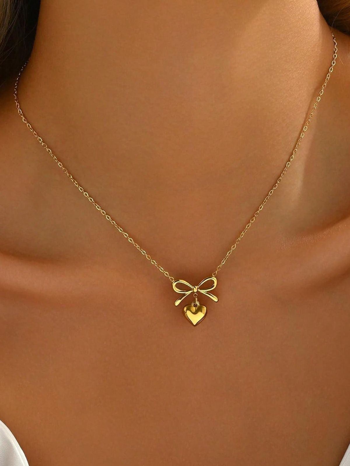 18 k pleated  heart bow necklace